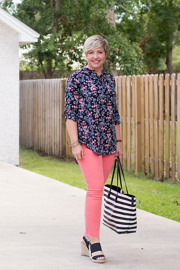 floral tunic top, coral jeans, distressed jeans, black wedges, striped tote, summer fashion