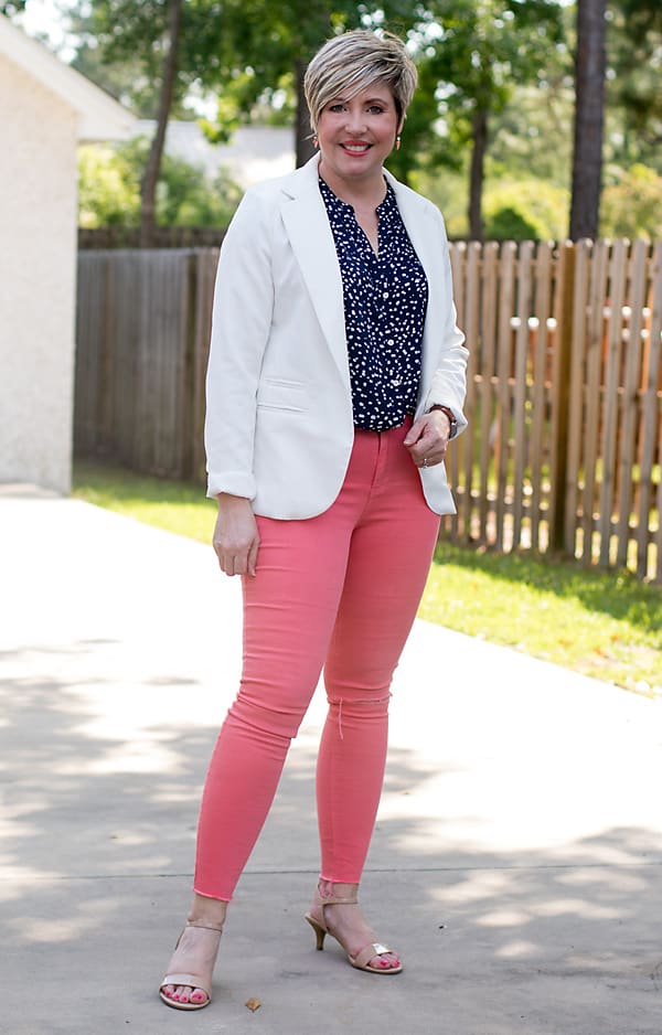 white blazer with coral jeans