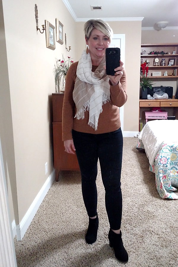 camel sweater and black jeans