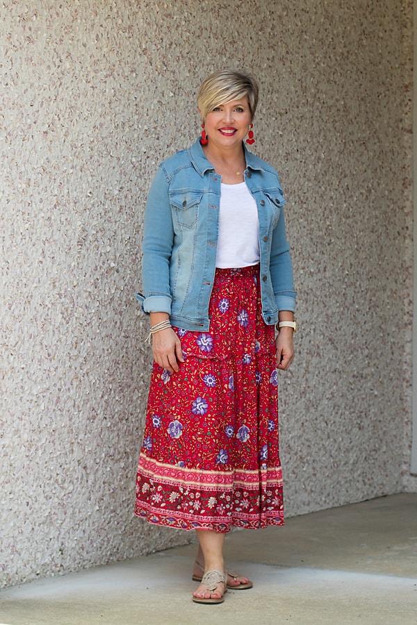 Wear a midi skirt with a light wash denim jacket in the summer.