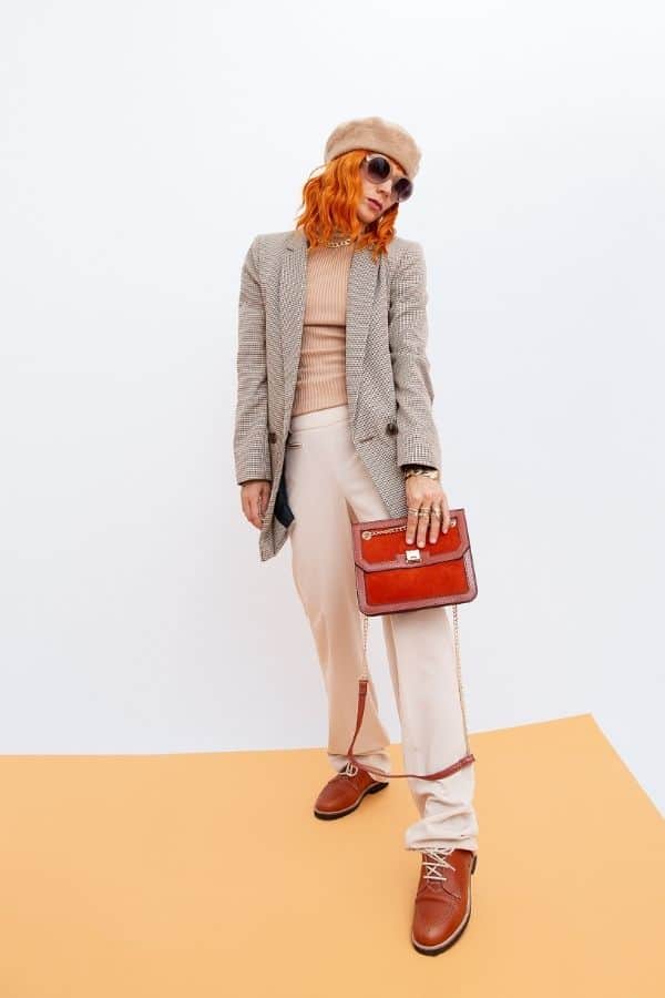 woman in androgynous style outfit with brown oxfords