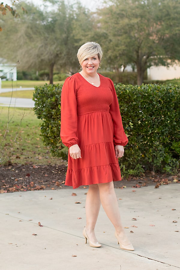 red smocked dress with nude heels